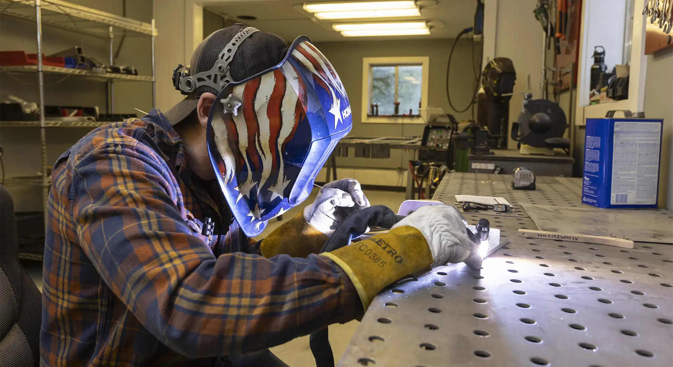 SasquatchXC employee welding in Silverton, CO